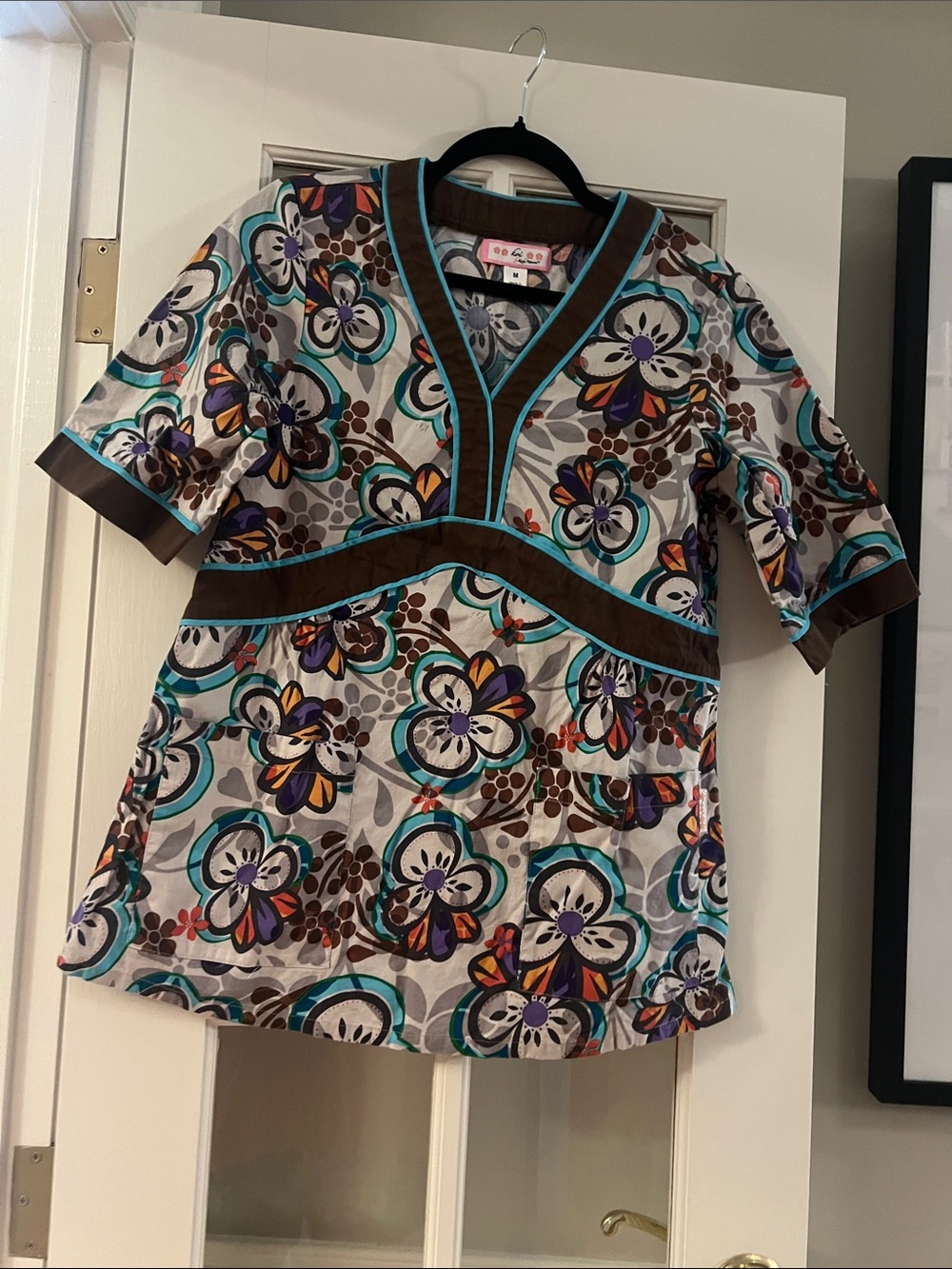 Koi Women’s Floral Scrub Top with Teal and Brown Trim